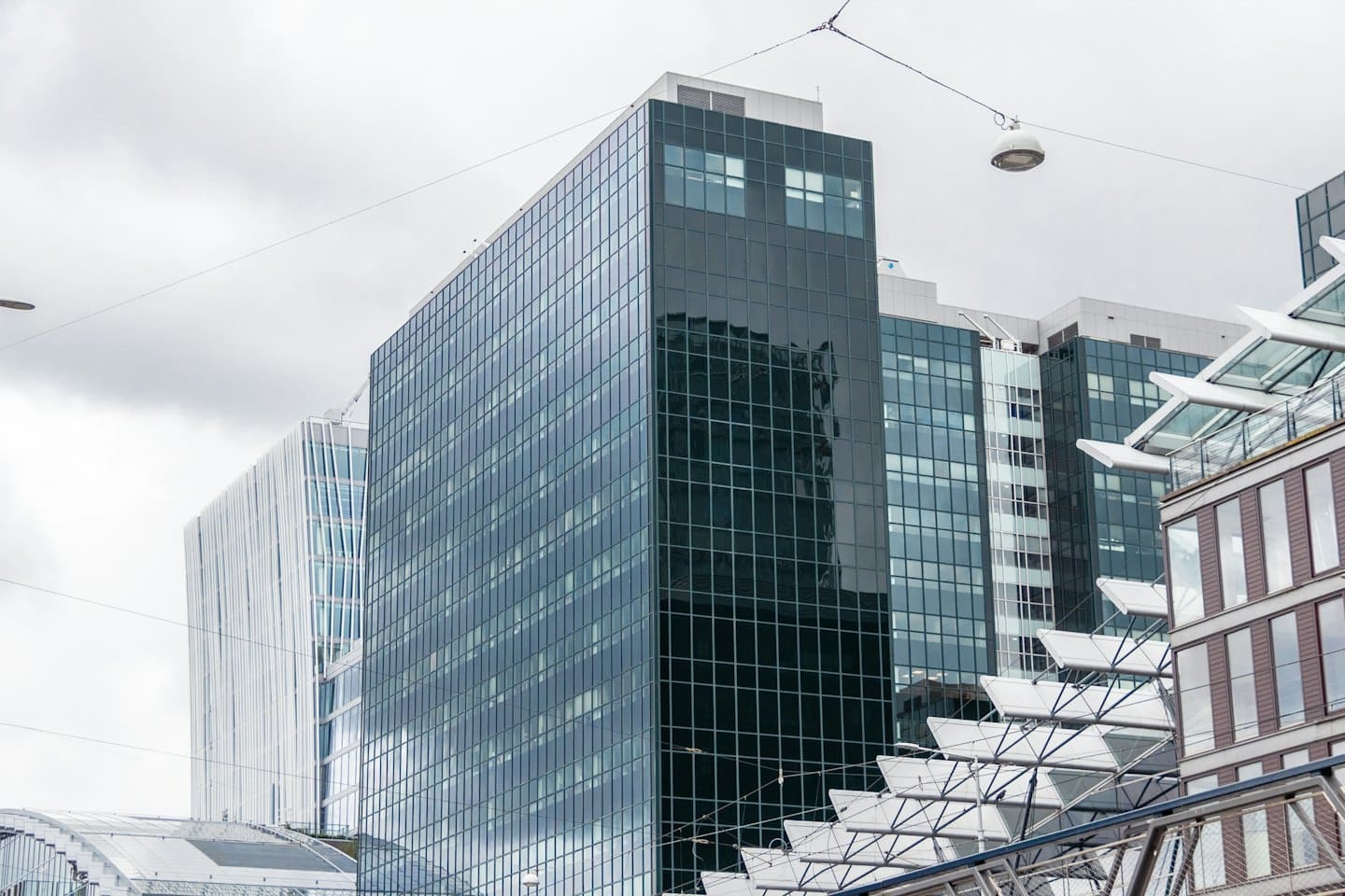 Modern corporate buildings with dark glass and concrete.